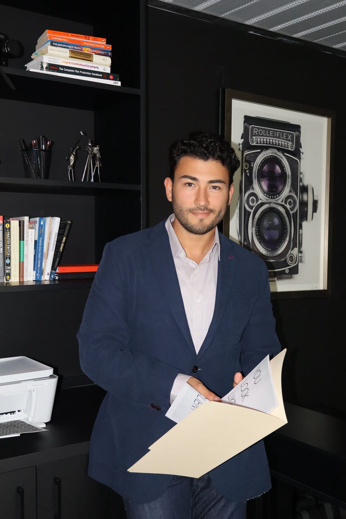Carlos Doce reviewing a plan in the studio
