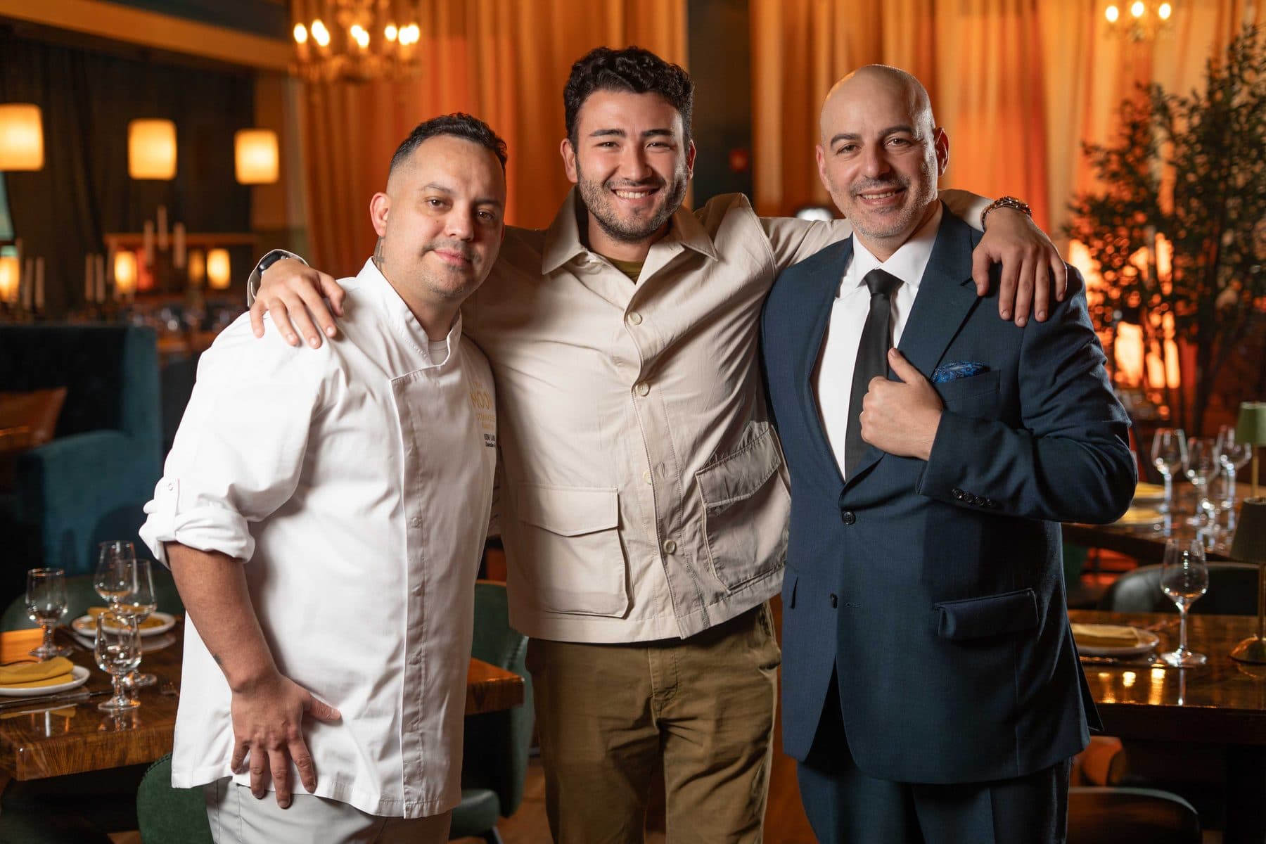 Carlos Doce with a restaurant’s chef and owner