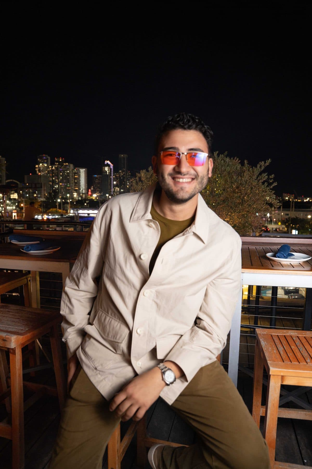 Carlos Doce on a rooftop over the Miami skyline